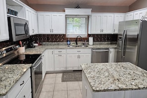 Fully Equipped Stainless Steel Kitchen.