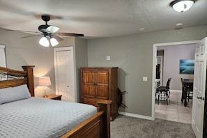 Second Bedroom with King-Size Bed, and Ceiling Fan. Private Entrance to Back Deck.