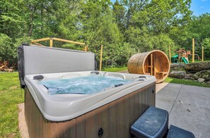 Pamper yourself in the hot tub and barrel sauna located on the patio outside the lower-level game room.