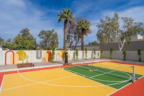 Enjoy a game of pickleball right in your backyard on this dedicated court, perfect for friendly competition and outdoor fun.