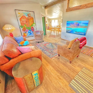 65 inch smart TV, queen sleeper sofa and all new paint, flooring.