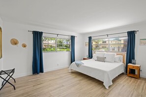 Comfortable king bed on the master’s bedroom in unit 1 :)