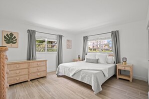 Secondary bedroom with a comfortable king bed in Unit 1.