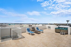 Enjoy the spacious rooftop where there's a hot tub and propane gas grill
