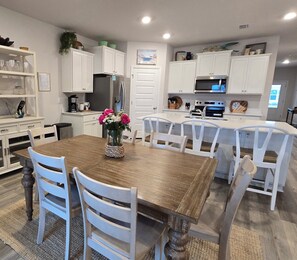 Dining table seats 6, island seats 4