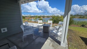 enlarged patio Table and chairs with cushions and propane fire pit
