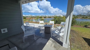 enlarged patio Table and chairs with cushions and propane fire pit