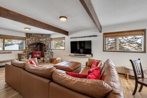 Downstairs family room with flat screen tv and fireplace