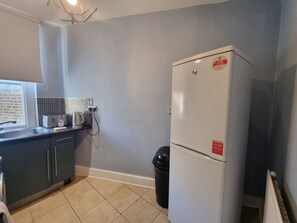 This photo represents the kitchen of the flat