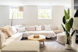 Living room has great ambiance with electric fireplace & dimmable lighting. 52" smart TV to watch your favorite shows.