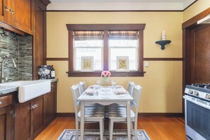 The kitchen has a full size fridge, gas range & farmhouse sink.  In addition to the basics, there's a full set of pots & pans, cookware and bakeware. 