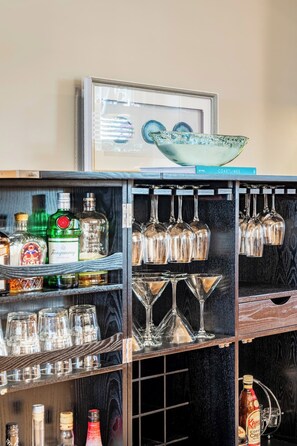 Bar, fully equipped with variety of barware & cocktail shaker