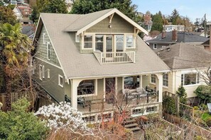 Beautiful home perched on edge of East Queen Anne with incredible sunset/ mountain/ bay views.