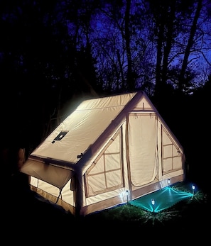 Safari tent with solar light turned on