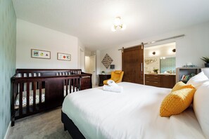 Spacious suite with king bed, private bath, toy nook and crib for little ones.