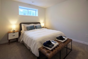 Spacious, serene bedroom with king bed, and cozy touches for restful nights.