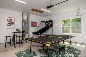 Game room with ping pong table, basketball arcade game and board games