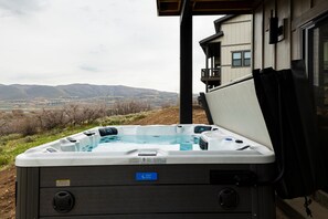 Lower level patio with a private hot tub