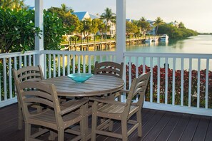 A balcony with water or resort grounds view