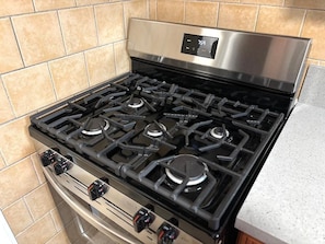 Large five burner kitchen stove.