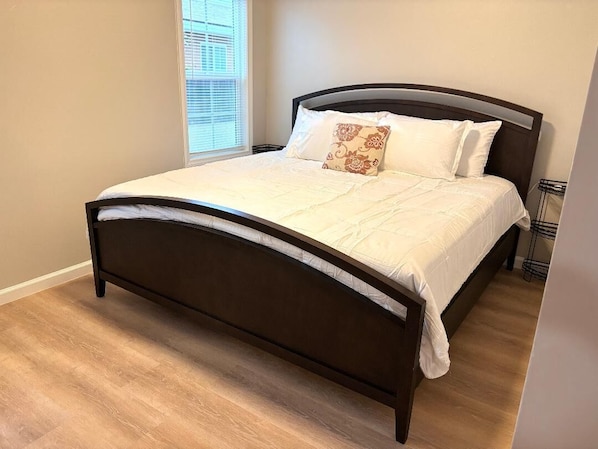 King-sized bed with memory foam bed mattress.