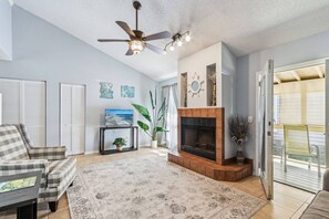 Living Room: Enjoy serene beach vibes in this airy space featuring modern decor and SMART TV