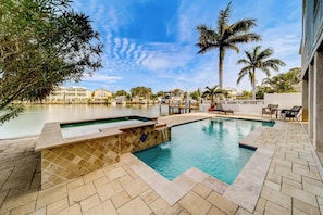 Enjoy sun-drenched pool days with serene water views as your backdrop!