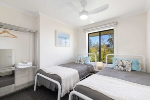 Third bedroom - 2 King Single Beds, Ceiling Fan & Open clothes hanger