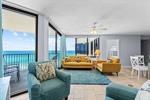 Soak in endless water views from every angle of this cheerful, coastal-themed living and dining space.