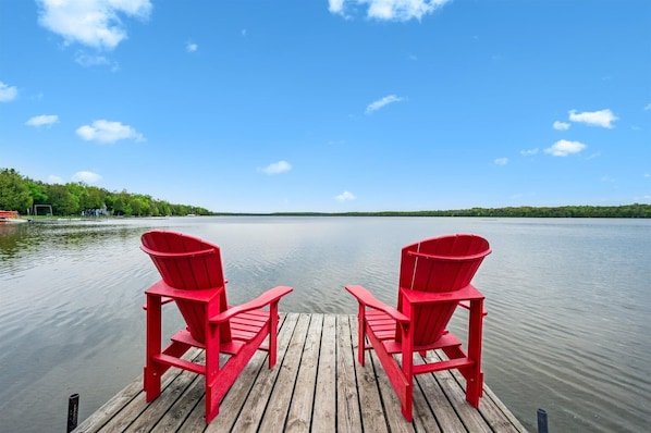 Relax in vibrant Adirondack chairs on the private dock, with panoramic views of peaceful Cameron Lake—the perfect place for sunrise coffees or sunset chats.