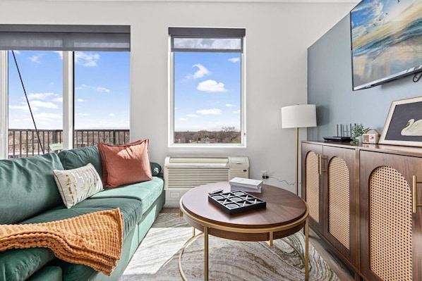 Living room area with wide windows and open space for exterior views