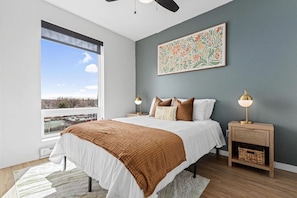 Spacious bedroom with stylish decor, perfect for unwinding after a day of exploring the local area.