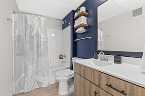 You feel a sense of calm as you enter the bathroom, where the thoughtful design and high-quality materials create a serene environment.