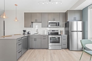 As you approach kitchen the elegant layout and well-stocked shelves make it the ideal spot to relax.