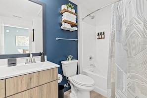 You feel a sense of calm as you enter the bathroom, where the thoughtful design and high-quality materials create a serene environment.
