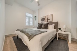 Spacious bedroom with stylish decor, perfect for unwinding after a day of exploring the local area.