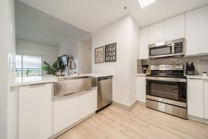 As you step into the kitchen, the clean lines and functional design make you eager to start cooking your favorite dishes.