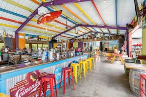 Kick back at the colorful Rock Island Tiki Bar! Enjoy tropical cocktails, casual bites, and live summer music — all just steps from the lake and pool. The ultimate hangout for unforgettable Branson nights!
