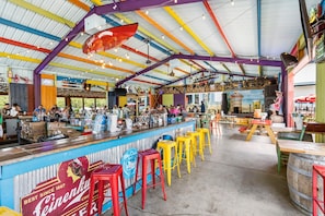Kick back at the colorful Rock Island Tiki Bar! Enjoy tropical cocktails, casual bites, and live summer music — all just steps from the lake and pool. The ultimate hangout for unforgettable Branson nights!
