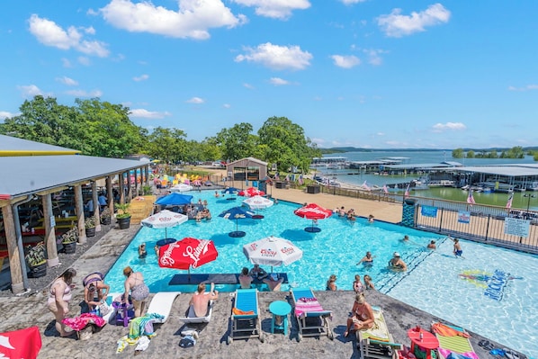 Dive into summer fun at Rock Lane's brand-new infinity pool! Lounge under colorful umbrellas, sip tropical drinks at the swim-up bar, and soak in those gorgeous Table Rock Lake views — all just steps from your condo.