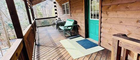 Front deck with seating area, propane fire pit and Blackstone grill