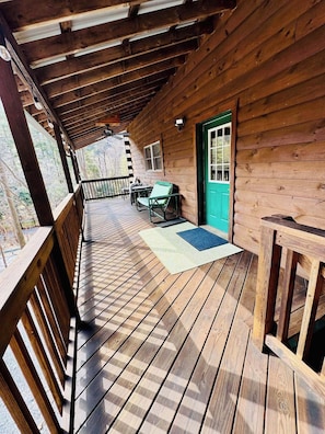 Front deck with seating area, propane fire pit and Blackstone grill