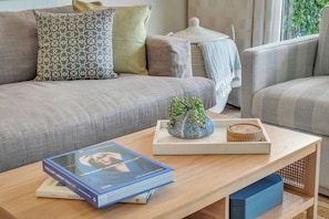 Details matter: a good book, soft textures, and little touches that makes your stay feel like home.