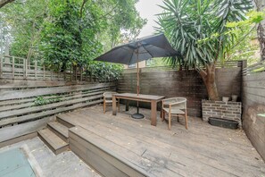 Ground floor - includes living area by the entrance and then the kitchen with dining table and the back terrace