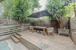 Ground floor - includes living area by the entrance and then the kitchen with dining table and the back terrace