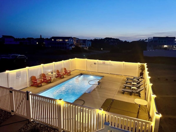 Our pool lights up at night, welcoming you for a swim.