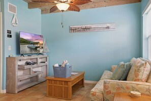 Coco Sands Studio #3 - Living area with TV and coffee table.