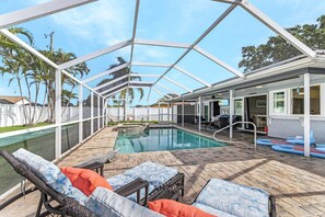Soak up the Florida sunshine and unwind by your private heated pool at Coral Breeze!