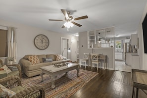 Inviting living room with comfy seating and smart tv access, for your entertainment and unwinding.