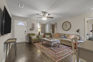Inviting living room with comfy seating and smart tv access, for your entertainment and unwinding.